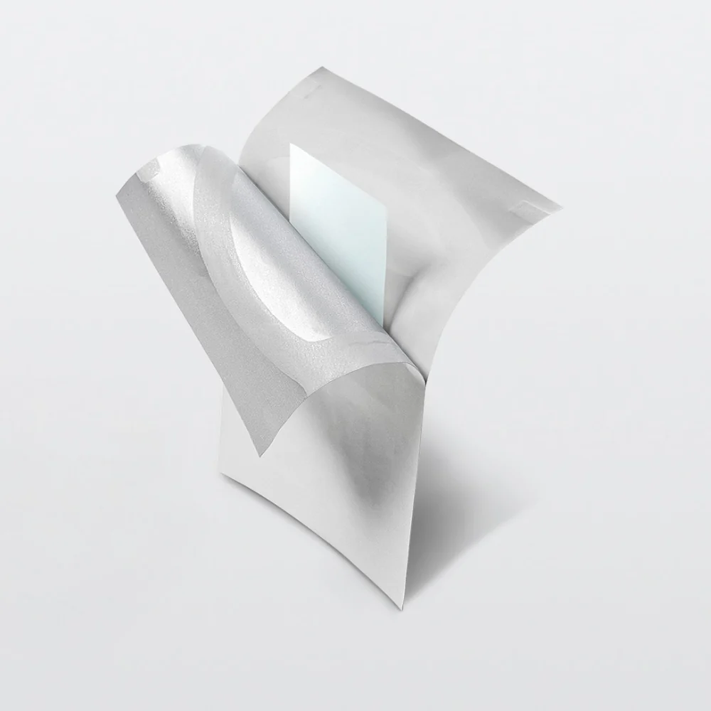 An InstaMed oral dissolving peptide strip lifted from its individually sealed foil sachet